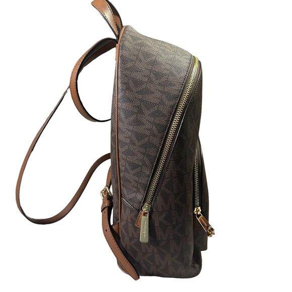 Michael Kors Mono-gram Canvas Jet Set
Backpack. Care tag included